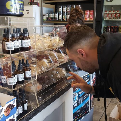 Griffin carefully chooses which flavor he needs from the SupHub bakery case...